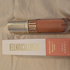 Nwt Beautycounter Beyond Gloss in bare shimmer.